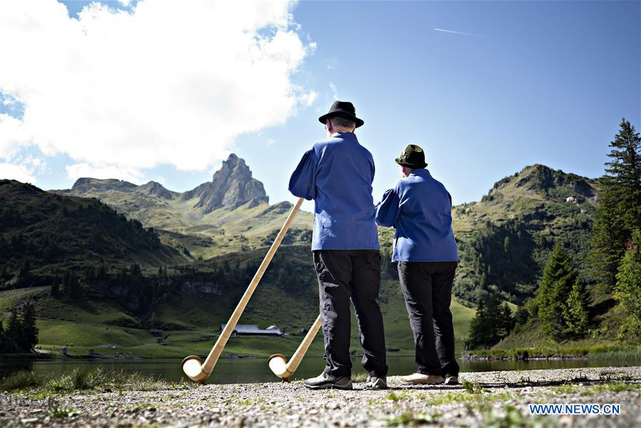 SWITZERLAND-SEEBENALP-SWISS ALPINE HORNS-PLAYING