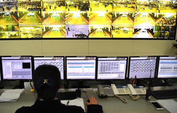 Staff members at Nanning East Railway Station busy working during Spring Festival travel rush